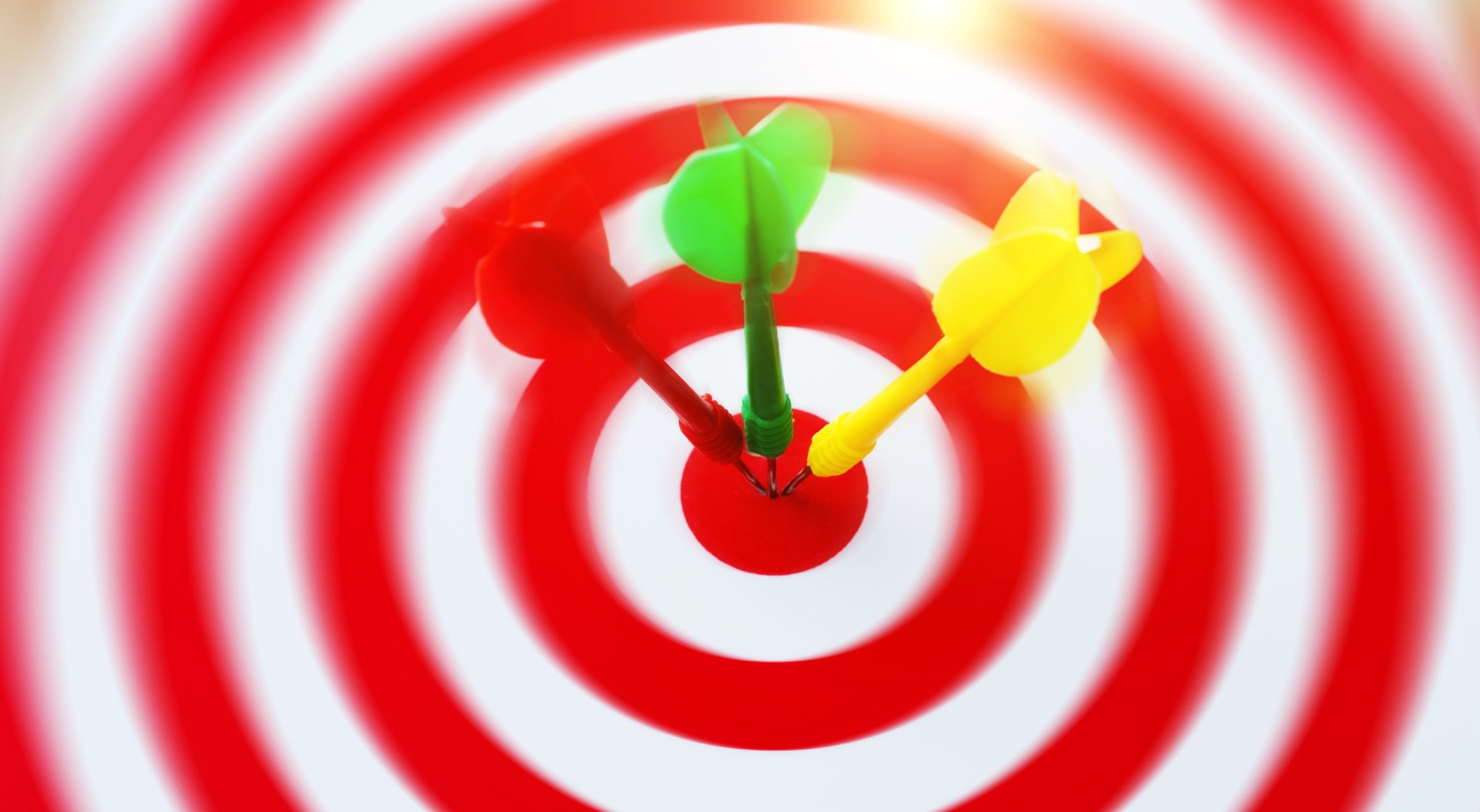 Three darts in the center of dartboard